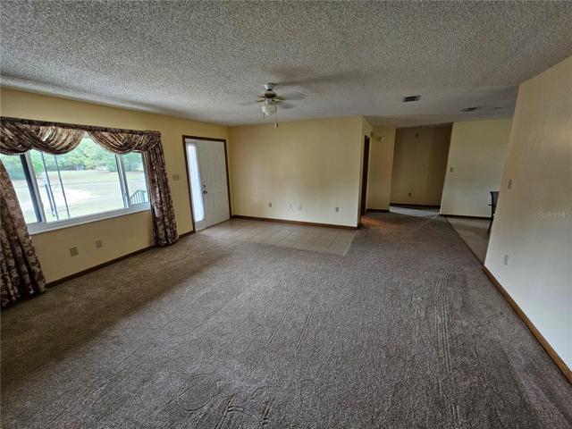 Living room, foyer and hall to spare bedrooms from master bedroom door