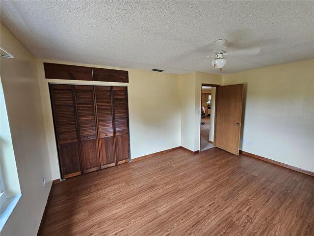 front spare bedroom with closet and door to hall