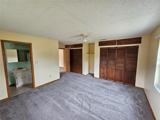 Master bedroom looking to bathroom and closets
