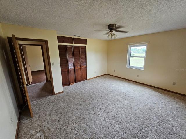 Back Bedroom closet and door to hall area.