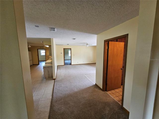 From bedrooms looking towards master bedroom, living room and kitchen