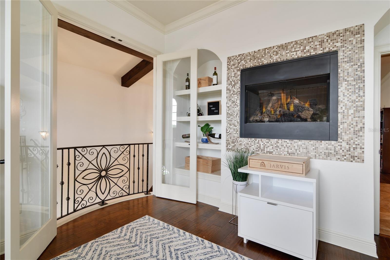 Flex Room (currently used as an office) with double fireplace.