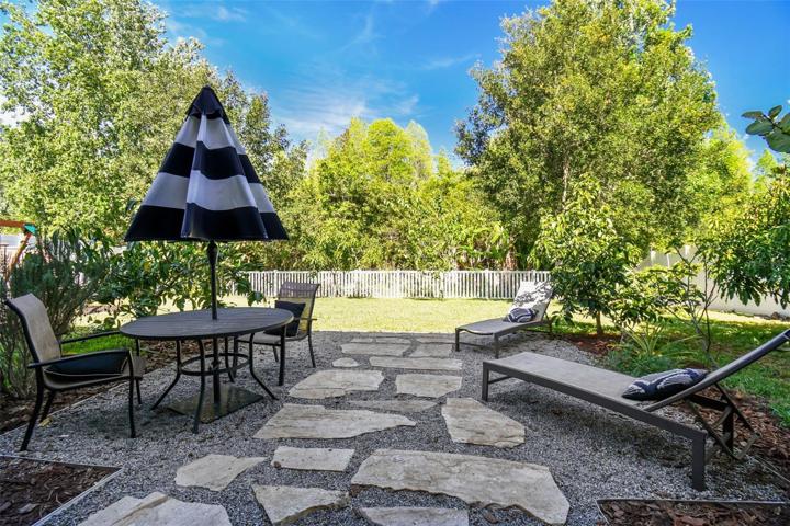 Your view from the breakfast area. The conservation area behind your home is a tropical paradise, featuring numerous mature palms and some of the finest fruit trees Florida has to offer including avocados, mulberries, mangoes, Barbados cherry, sugar apples, and more.