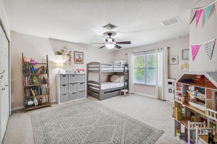 The substantial second bedroom is bright and cheery, with plenty of natural light.