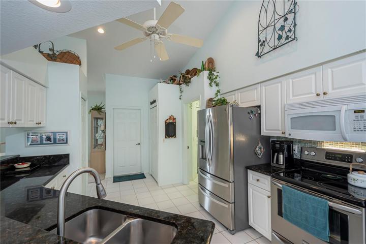 Stunning kitchen to laundry room and garage