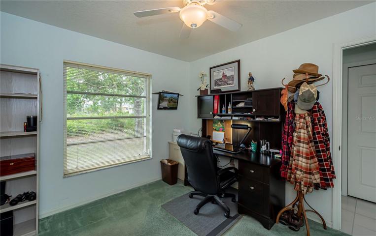 Front auxiliary bedroom is being used as an office with a Murphy Bed (which will be removed by seller)