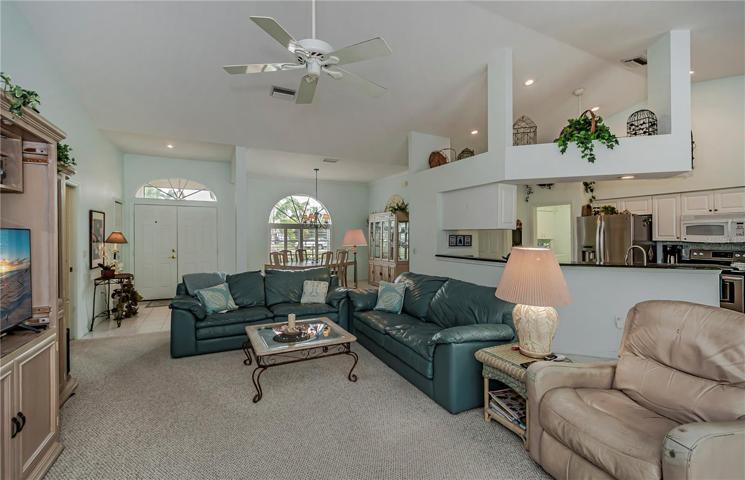 open floor plan with soaring ceilings