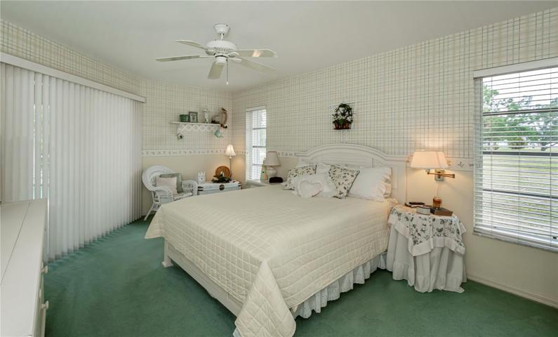 Ensuite main bedroom opens to the lanai & pool