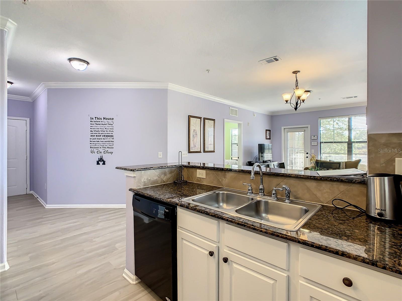 Kitchen through hallway and living area