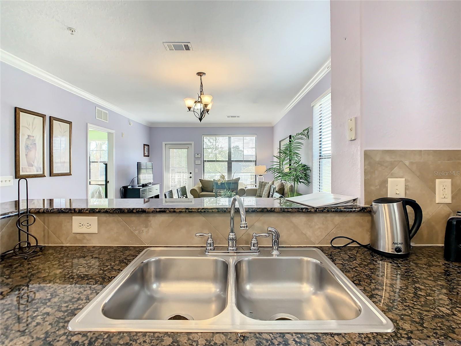 Kitchen adjoining dining and living area