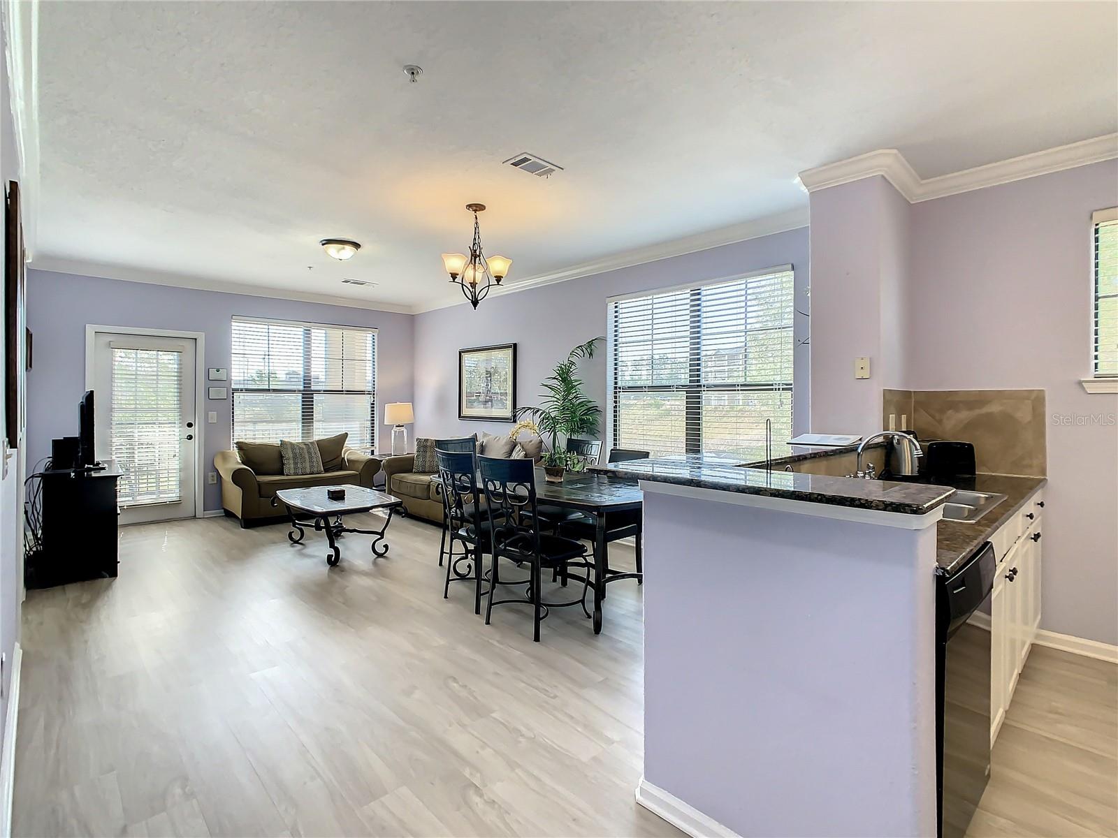 View from hallway looking towards kitchen, dining and living area