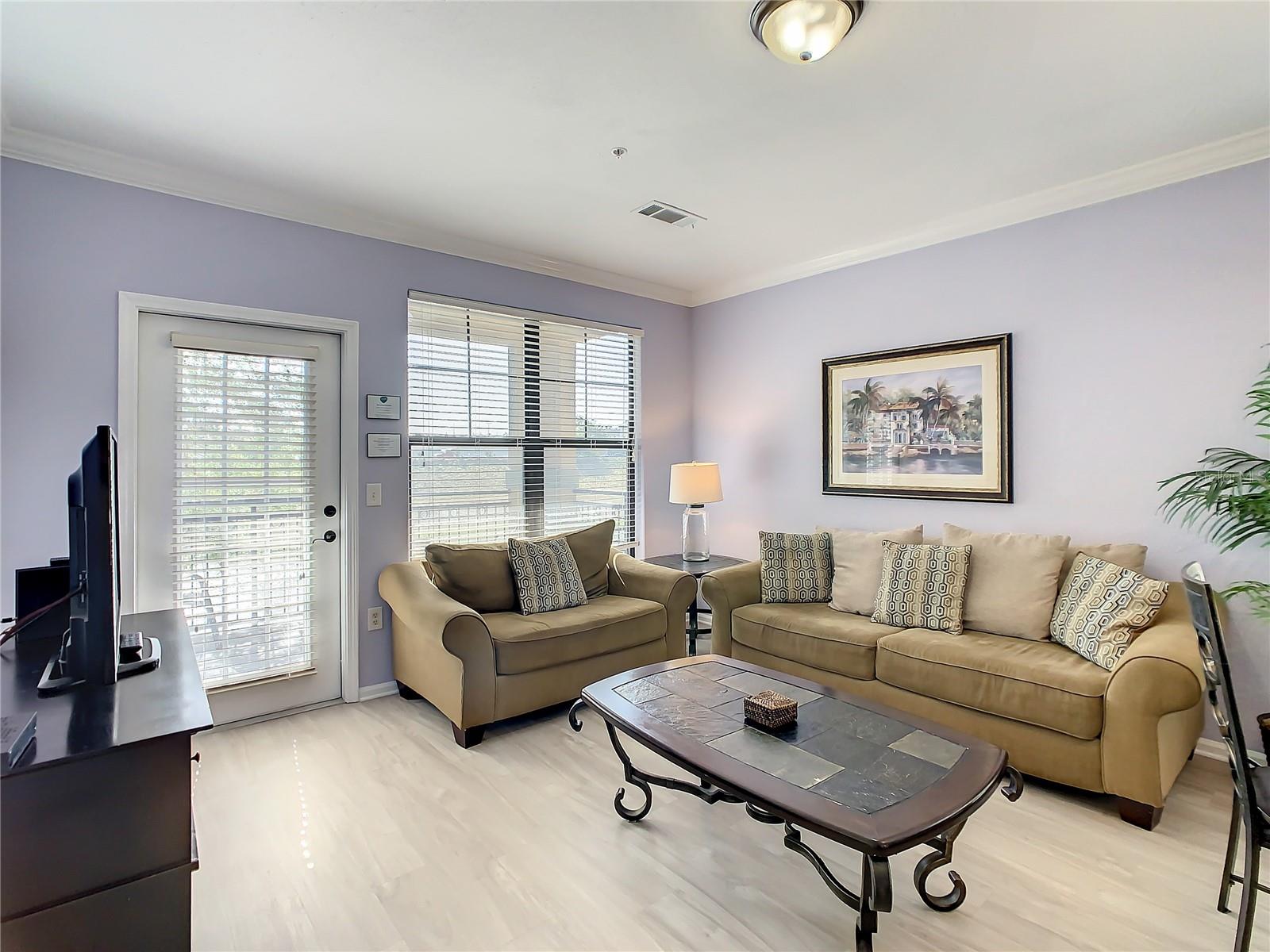 Living area with access to covered balcony