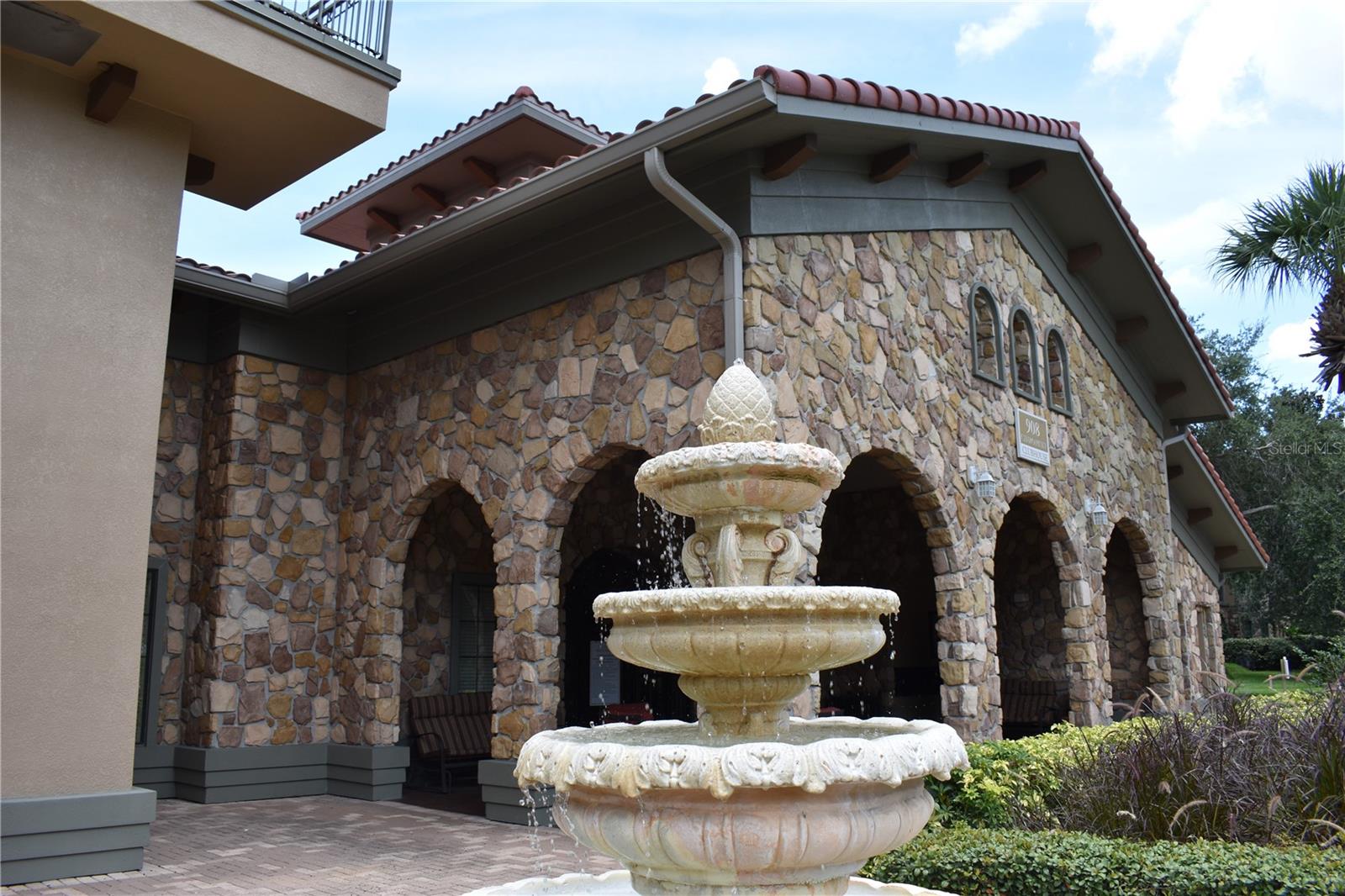 Fountain With View Of Courtyard Seating In Rear