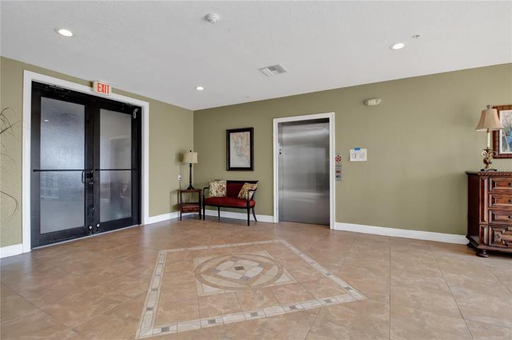 Unit 121's two parking spaces are right outside the double doors above.