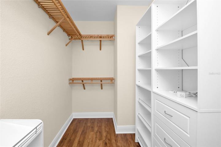Huge custom-designed walk-in closet offers lots of storage!