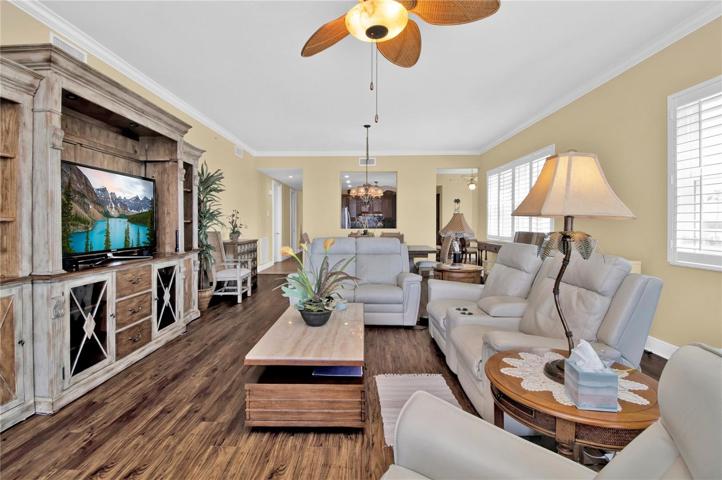 Soft neutral colors adorn the walls that lead to 10-foot ceilings with crown molding