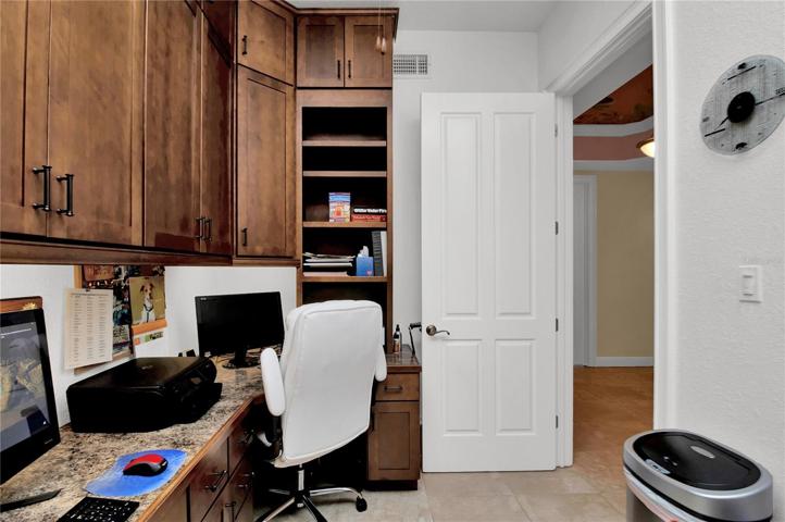 Just off the entryway, a custom-designed office awaits your