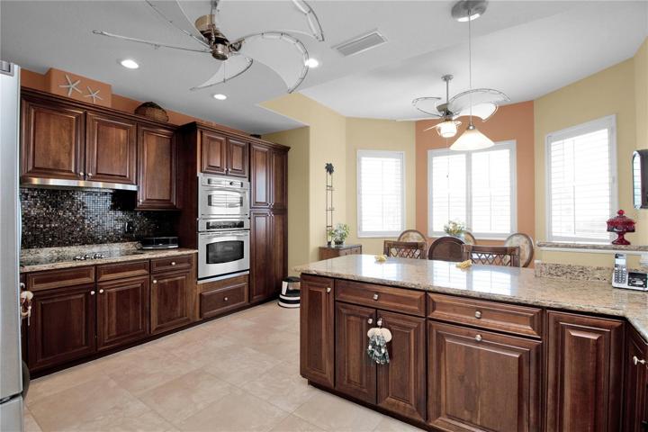 Custom ceiling fans add to the ambience of your kitchen/breakfast bar/breakfast nook areas.