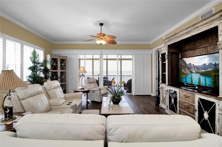 The view through your living area reveals an infinity-pool like view of the Harbor/Bay