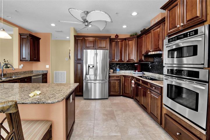 Exquisite kitchen with SS appliances and 42" cabinets with pull-outs
