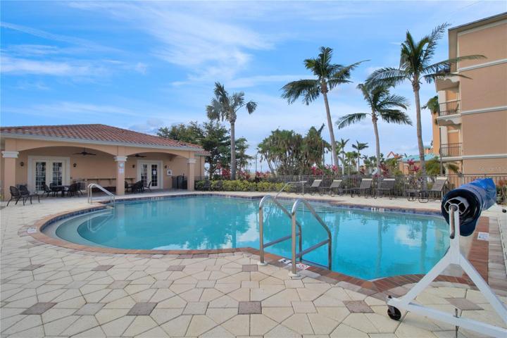 Clubhouse, featuring fitness center, kitchen, lounge area with tv, and restrooms