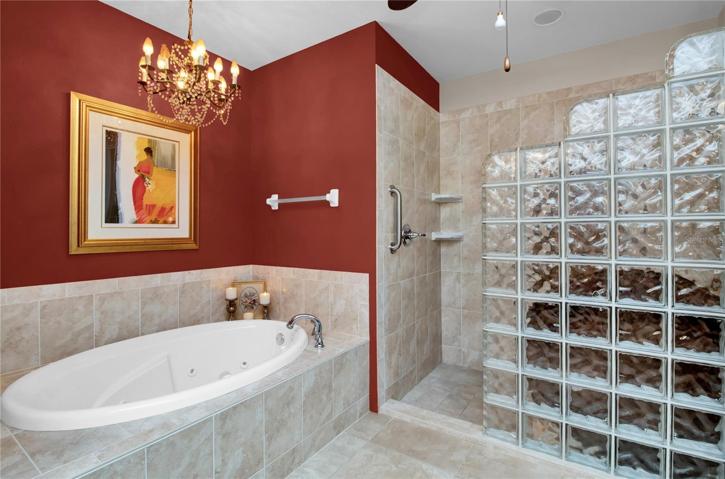 Jetted tub, double vanities and large shower complete this spa-like bathroom.
