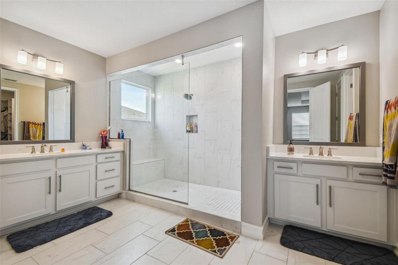 dual sinks with large walkin shower