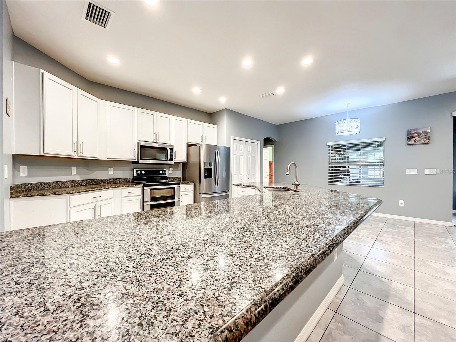 Breakfast Bar Seating and Dinette Area off Kitchen