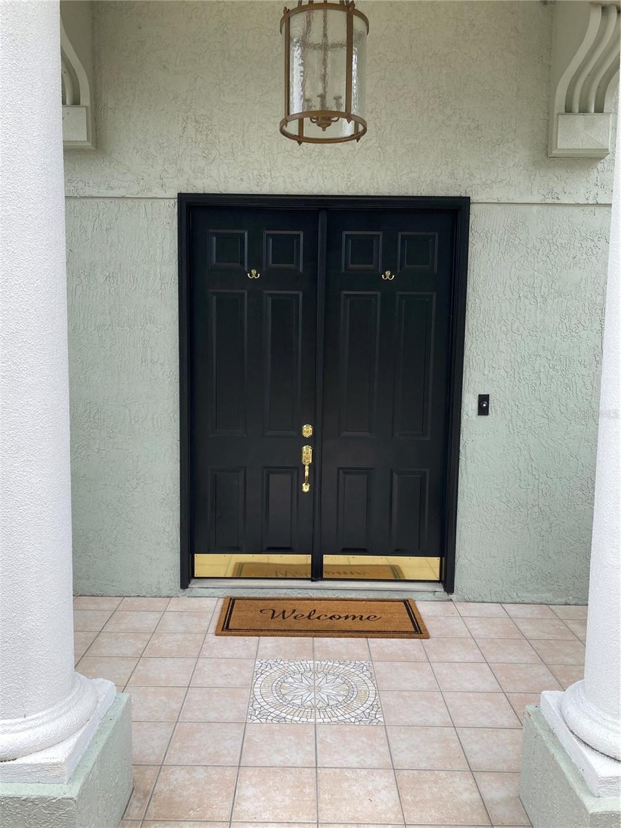 Tiled grand entrance.Large double front doors