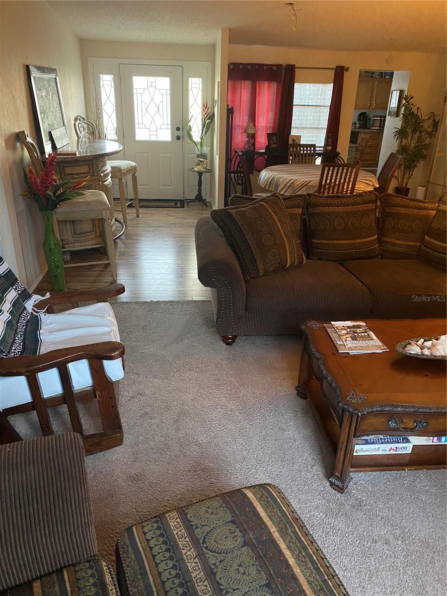 View from living area toward the front door where the deck is on the main  home 