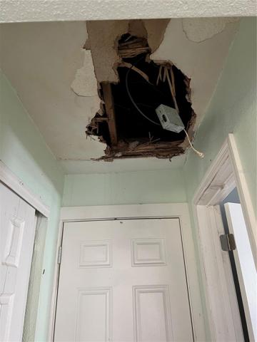 8101 Hixton Dr hall way between garage and kitchen ceiling damage
