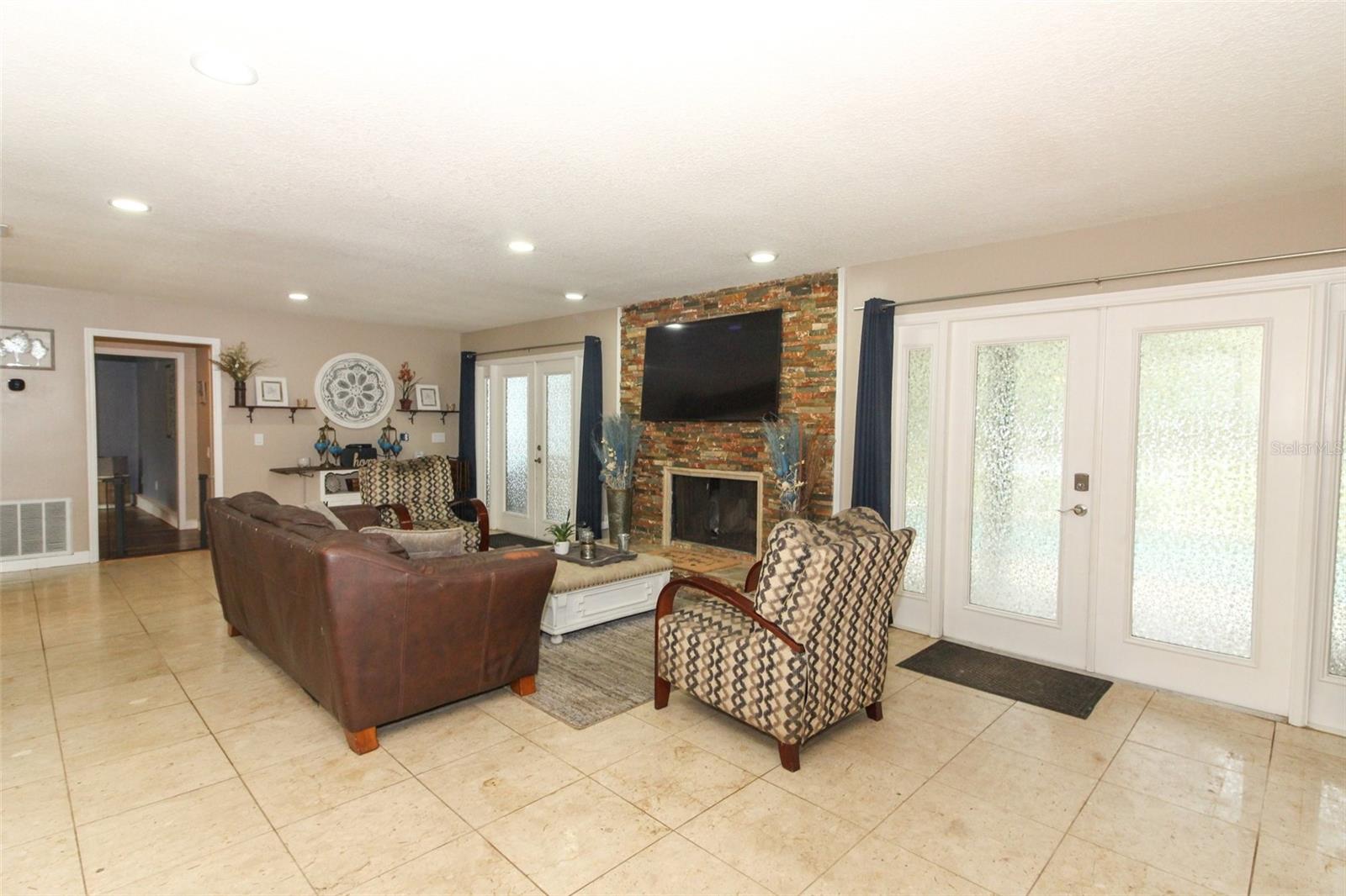 Living room with wood-burning fireplace