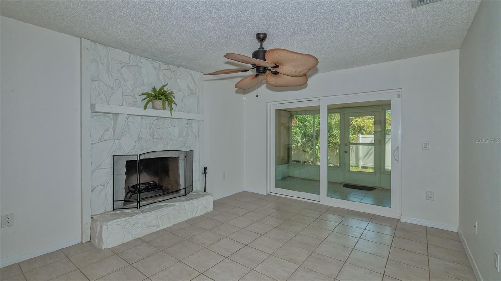 Living room with wood burning fireplace