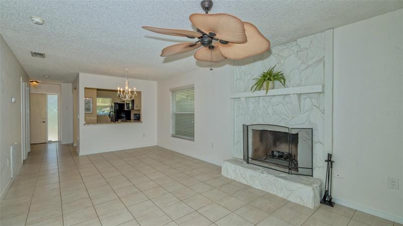 Living/dining with wood burning fireplace