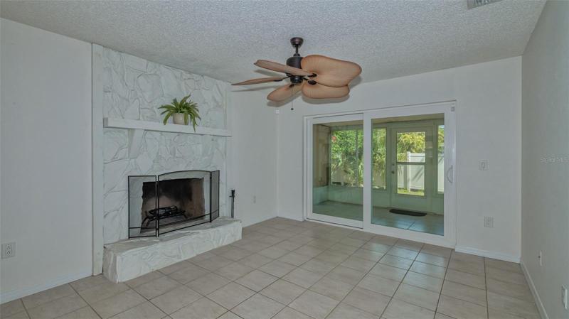 Living room with wood burning fireplace