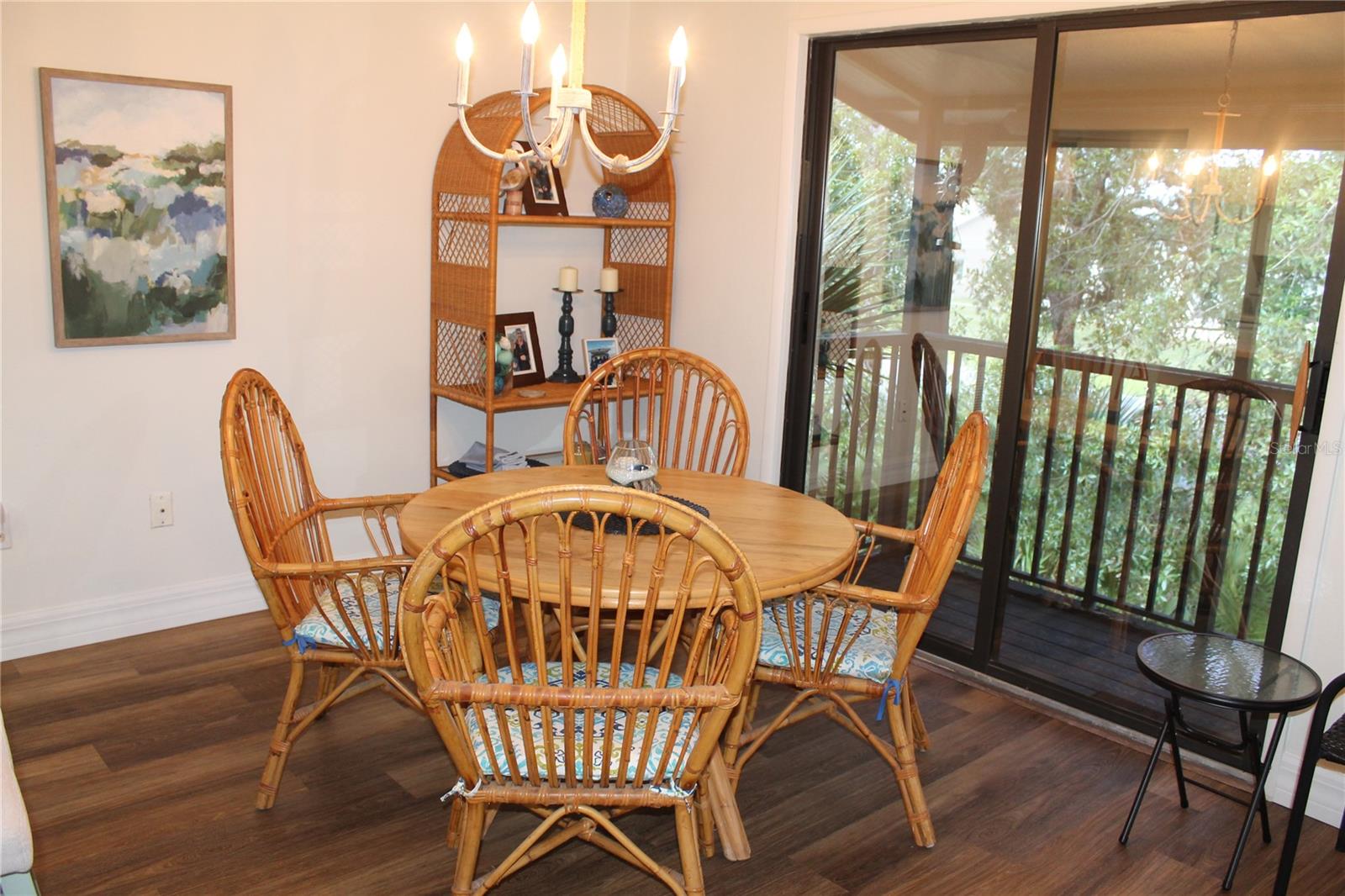 Dining Area Off Kitchen To The Left And Screened Balcony To The Right.