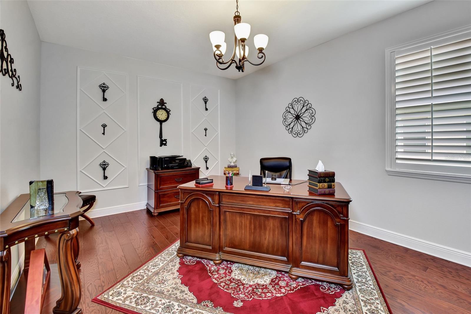 Foyer with tray ceiling and crown molding