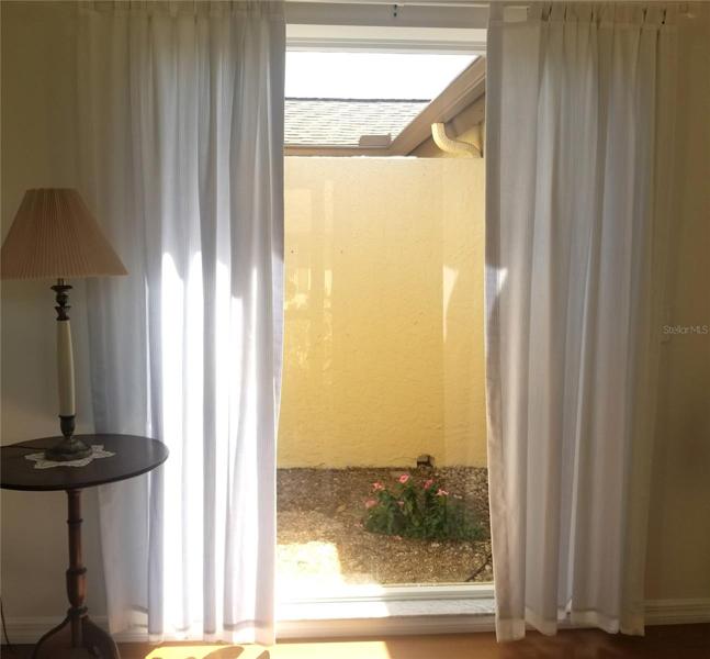 View into walled courtyard from front entrance