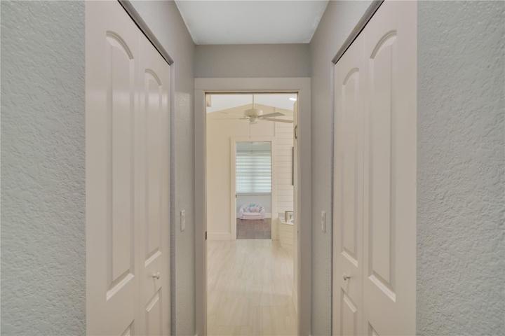 Two walk in closets on the way to the en suite bath