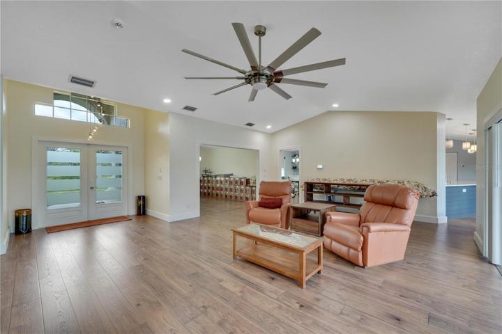 Living room, front doors, dining room