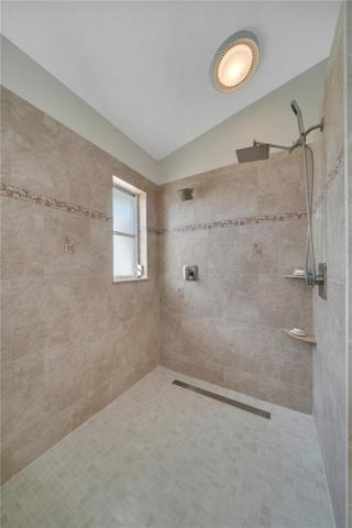 Roomy and light custom tiled walk in shower