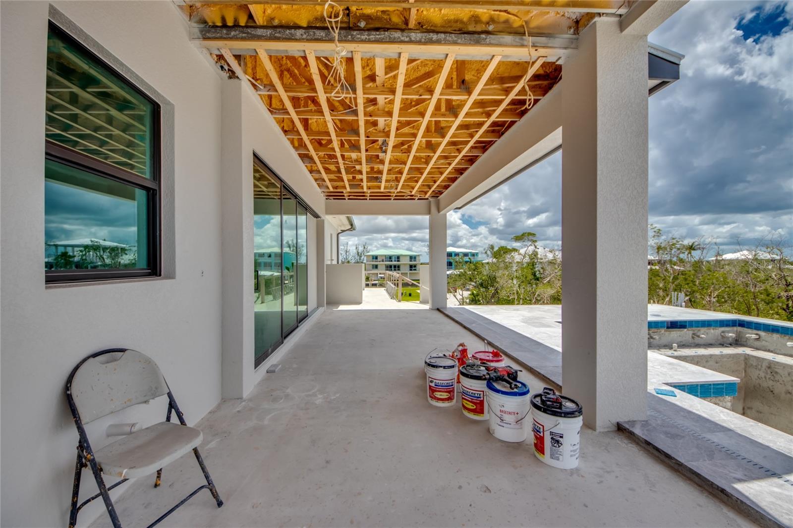 This entire corner will have an L-shaped oversized outdoor kitchen island along with buffet and additional features along the wall.  If you love to entertain or cook outside, this home was definitely meant for you!