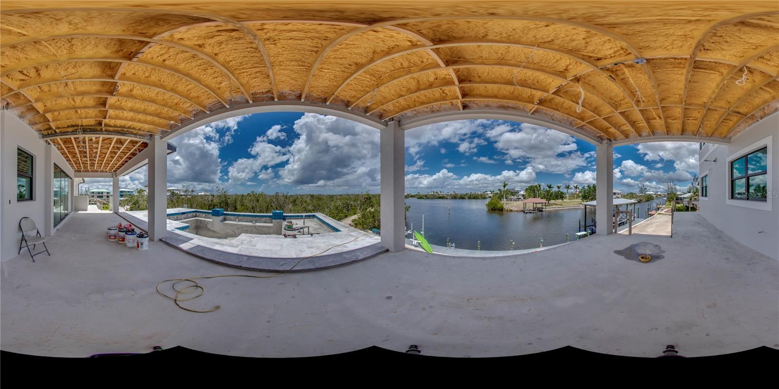 Panoramic view of the outdoor pool area, wrap around porch and those incredible views!