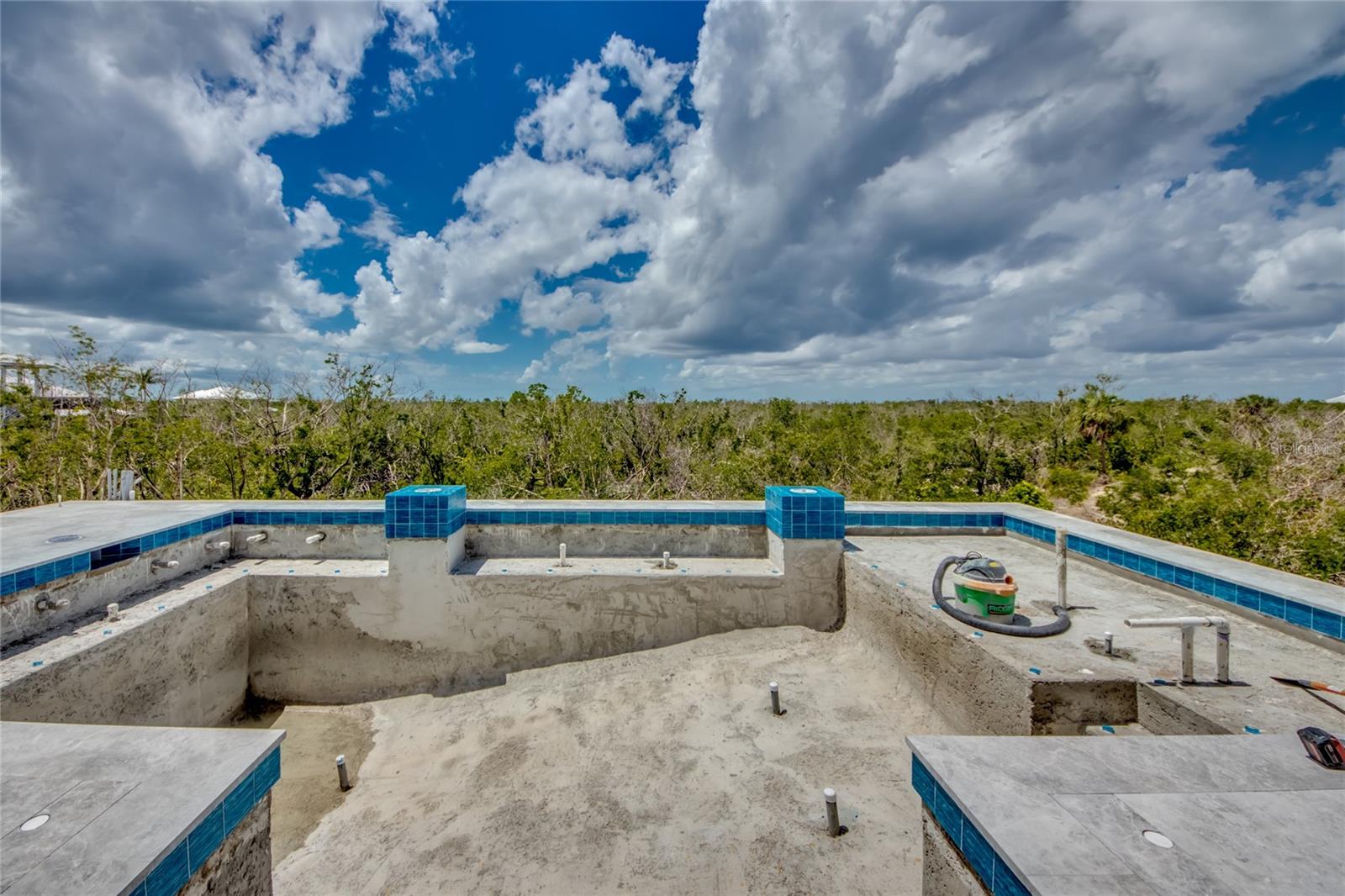 Take a deep dive into this beauty or relax on the sun ledge.  A wonderful pool to relax in and the show piece of this home.  Panoramic views and nature abound!