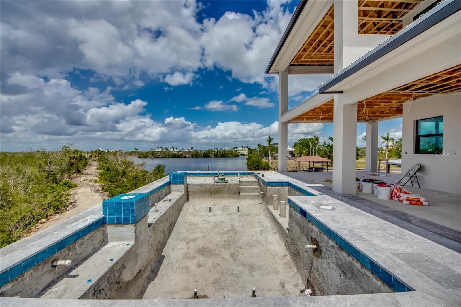 Home away from home directly in your back yard!  This home was built to live, play and even work in!  Easy accessibility to all levels via the elevator!