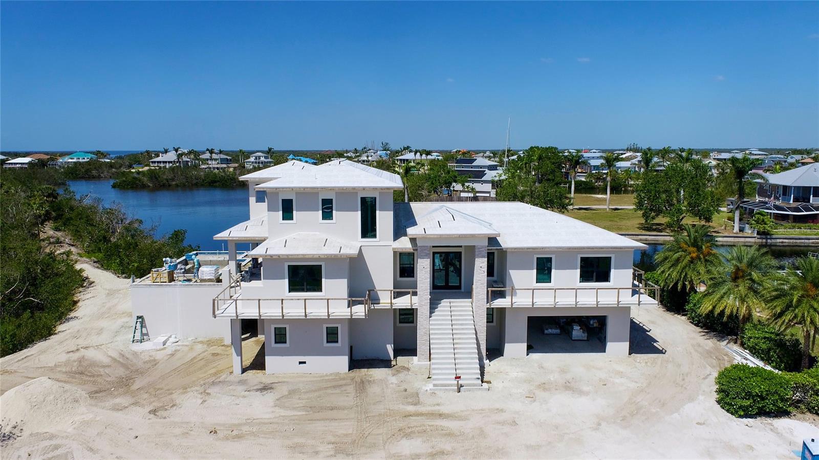 Anticipated completion date of August 2023, this is a custom estate built to the highest level of construction!  Located on a double lot and next to a State owned preserve, this offers not only an amazing home, but a second story resort style pool with views out to Boca Grande and Cayo Costa!  Some of the best fishing in America is right here at your door step!  Easy boating access to all the islands including Useppa Island, Captiva, Upper Captiva, Sanibel, St James City, Bokeelia, Boca Grande, Gasparilla Island and so many more!