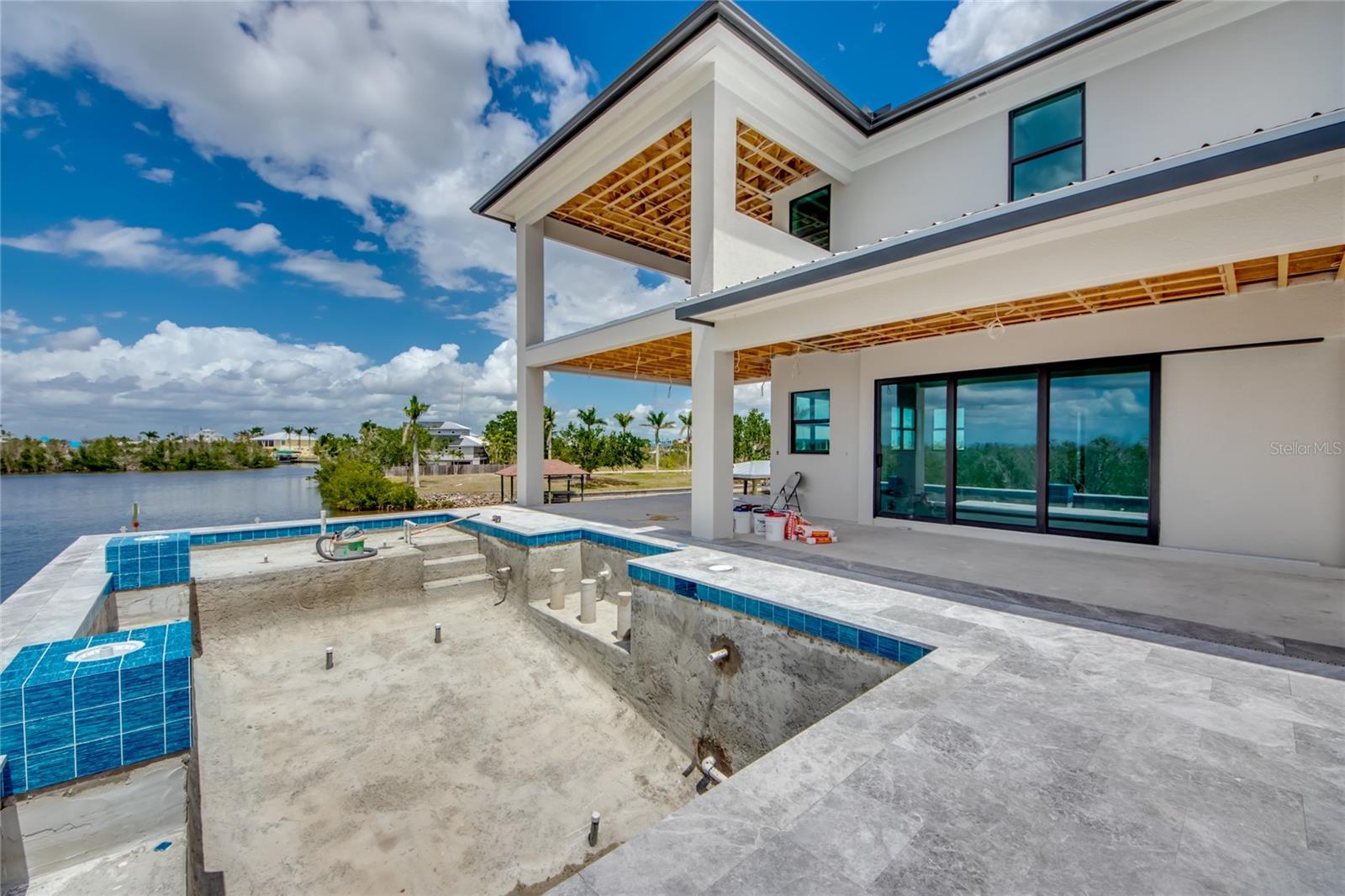 There are pools and then there is this one!  Magazine worthy, this pool features multiple different areas including spa therapy jets, glass bowls with color changes, sit down bar and so much more!  
