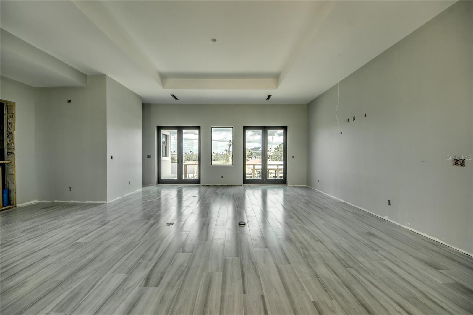 Great room - every room has an amazing view - lots of thought put into the design of this home, including simple touches such as in ground outlets, sound system, and so much more!  The devil is in the details and they are abundant everywhere!