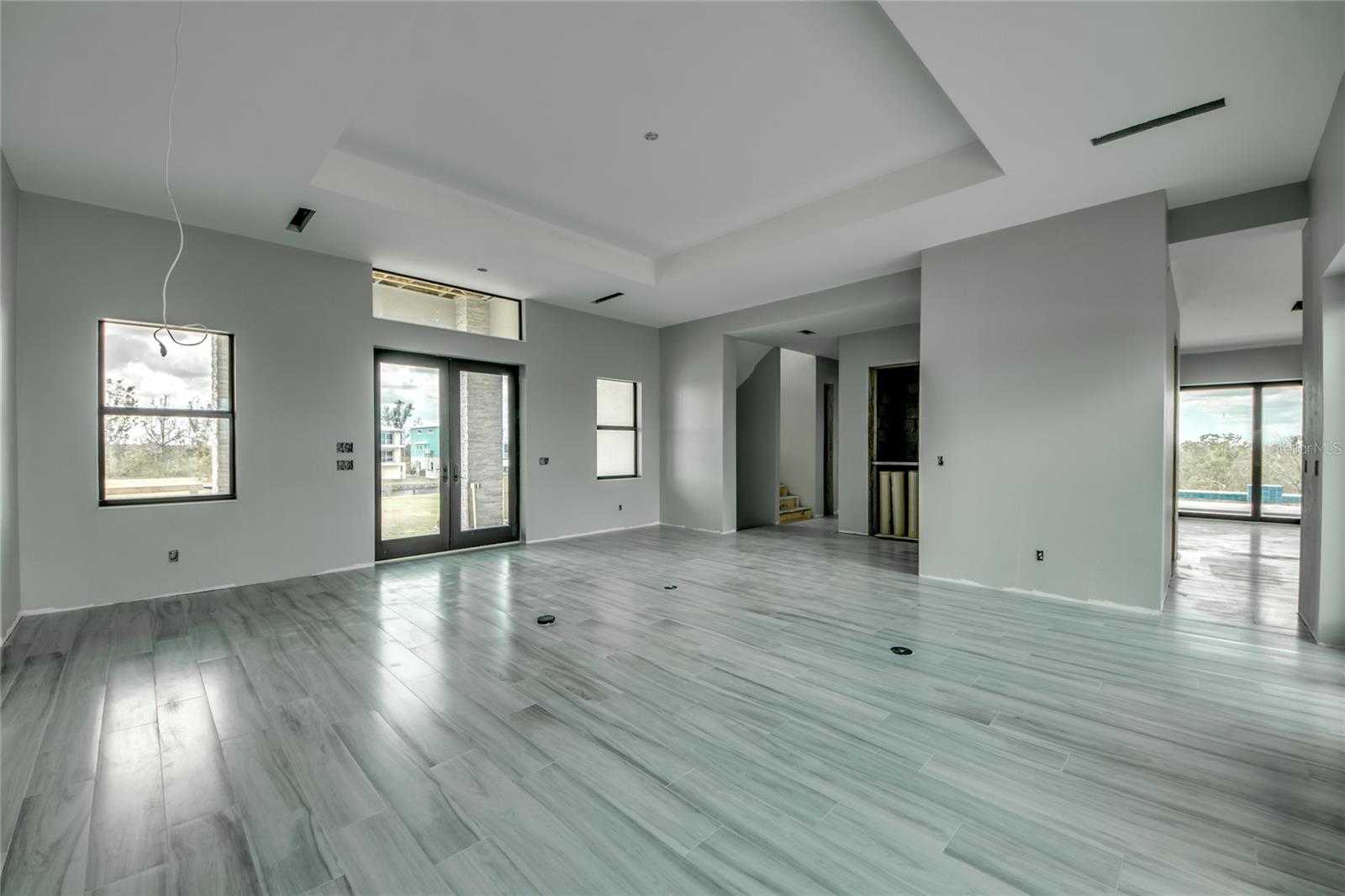 The main living area was designed with separate family room and easy access to the designer kitchen and outdoor areas.  