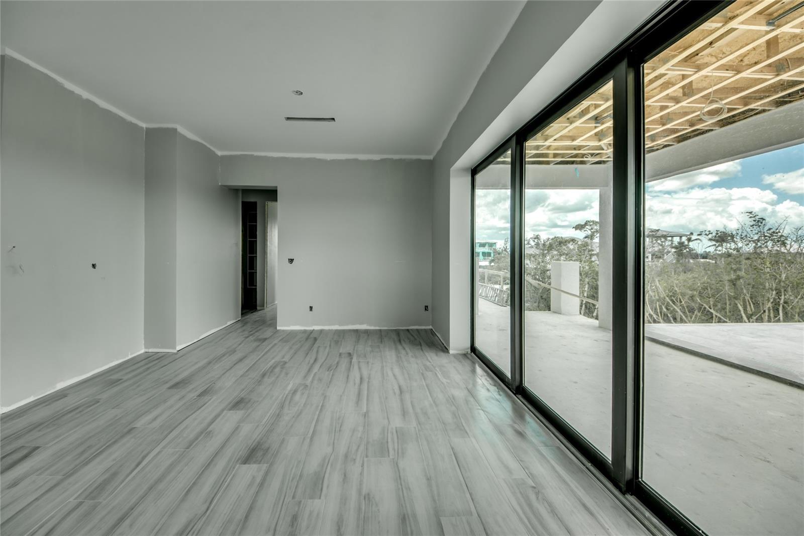 Triple sliders off the dining area give direct access to the INCREDIBLE outdoor area - if you are hosting a small or very large gathering, this was designed to accommodate all sizes!  Another room filled with natural light!